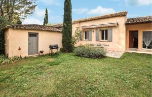 a house with a lawn in front of it at Gorgeous Home In Saint Saturnin Lès Avi in Saint-Saturnin-les-Avignon +20 photos