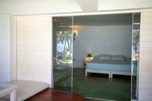 A bed or beds in a room at Sunset Mancora