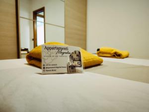 Postel nebo postele na pokoji v ubytování Appartamento Magnolia 2