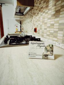 Kuchyň nebo kuchyňský kout v ubytování Appartamento Magnolia 2