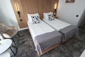 Postel nebo postele na pokoji v ubytování Hotel Soimul