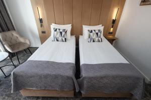 Postel nebo postele na pokoji v ubytování Hotel Soimul