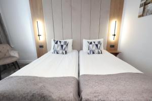 Postel nebo postele na pokoji v ubytování Hotel Soimul