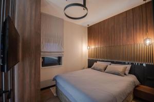 Postel nebo postele na pokoji v ubytování UpArt Home & Spa