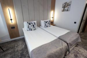 Postel nebo postele na pokoji v ubytování Hotel Soimul