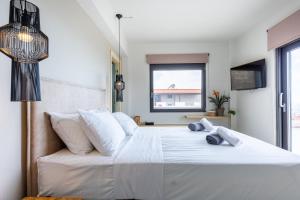 Ένα ή περισσότερα κρεβάτια σε δωμάτιο στο Blue Horizon Villa