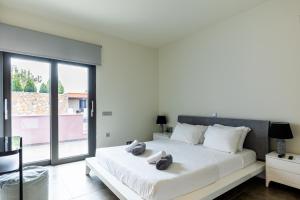 Ένα ή περισσότερα κρεβάτια σε δωμάτιο στο Blue Horizon Villa