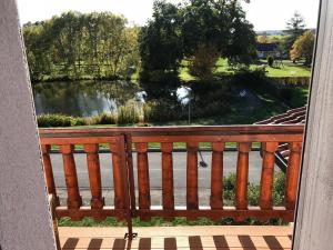 a view of a lake from a balcony at Hotel Wettlaufer - 3 Sterne S - sky - in Homberg