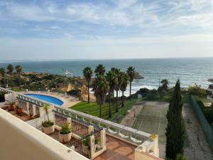 a view of the ocean from the balcony of a house at Silver Moon Beach House in Lagos