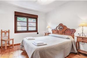 Postel nebo postele na pokoji v ubytování La Jomeruca ,espaciosa casa rural cerca de playa y montaña
