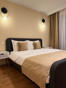 Ένα ή περισσότερα κρεβάτια σε δωμάτιο στο Bentley Apartments