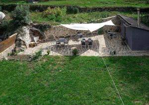 O grădină în afara Val Aran acogedor apartamento con jardín y vistas