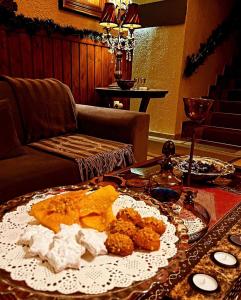 a table with a plate of food on a table at Fanaras Hotel in Kalavrita