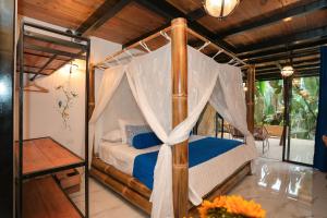 Postel nebo postele na pokoji v ubytování Suites Casa ColibrÍ