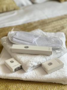 two batteries sitting on a pile of towels at Golden Hotel in Vyšší Brod