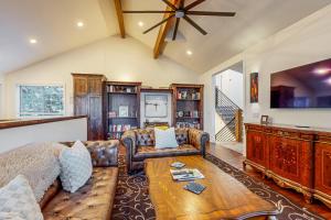 a living room with a couch and a table at Mountain View Retreat - Unit A - Main Home in Park City