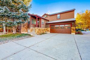 a house with a driveway and a garage at Mountain View Retreat - Unit A - Main Home in Park City