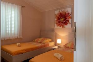 Posteľ alebo postele v izbe v ubytovaní Apartment Daniela