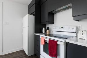 Kuchyň nebo kuchyňský kout v ubytování Logement neuf, spacieux
