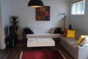 Posezení v ubytování Logement neuf, spacieux