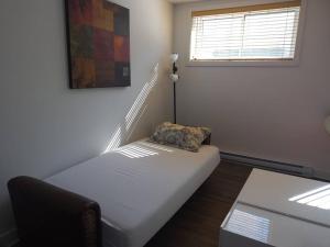 Postel nebo postele na pokoji v ubytování Logement neuf, spacieux