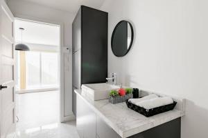 Kuchyň nebo kuchyňský kout v ubytování Logement neuf, spacieux