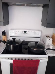 Kuchyň nebo kuchyňský kout v ubytování Logement neuf, spacieux