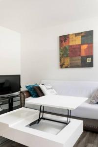 Posezení v ubytování Logement neuf, spacieux