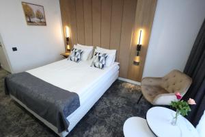 Postel nebo postele na pokoji v ubytování Hotel Soimul