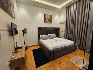 Giường trong phòng chung tại Atlantic Experiences, Garki, Abuja