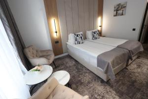 Postel nebo postele na pokoji v ubytování Hotel Soimul