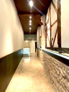 a long hallway with a staircase in a building at San Juan Centro Histórico in Burgos
