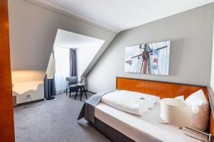 Postel nebo postele na pokoji v ubytování ATLANTIC Hotel Vegesack