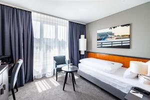 Postel nebo postele na pokoji v ubytování ATLANTIC Hotel Vegesack