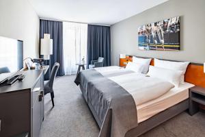 Postel nebo postele na pokoji v ubytování ATLANTIC Hotel Vegesack
