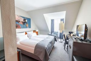 Postel nebo postele na pokoji v ubytování ATLANTIC Hotel Vegesack