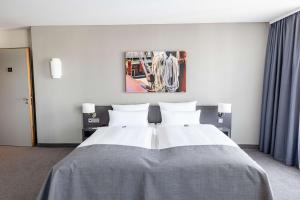 Postel nebo postele na pokoji v ubytování ATLANTIC Hotel Vegesack