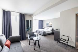 Postel nebo postele na pokoji v ubytování ATLANTIC Hotel Vegesack + 35 fotografií