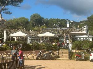 a group of people standing in front of a building at Canyelles BBQ Apartment in Lloret de Mar