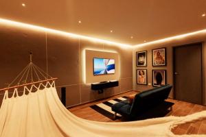 TV a/nebo společenská místnost v ubytování Hermoso LOFT en Guaduas