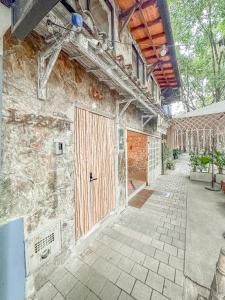 a building with a wooden door on the side of it at Casa Lezzet in Medellín