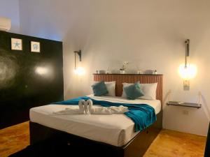 Postel nebo postele na pokoji v ubytování Hotel Rincon Rubi