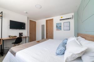 TV a/nebo společenská místnost v ubytování Casa Gracia Hotel Boutique
