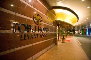 a lobby of a building with a sign on the wall at Tobu Hotel Levant Tokyo in Tokyo
