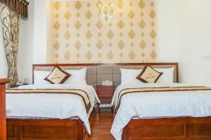 Postel nebo postele na pokoji v ubytování Diamond Hotel