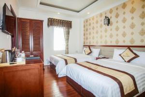 Postel nebo postele na pokoji v ubytování Diamond Hotel