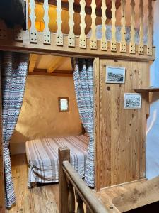 a room with a bunk bed in a cabin at Loustalet in Saint-Jean-de-la-Blaquière