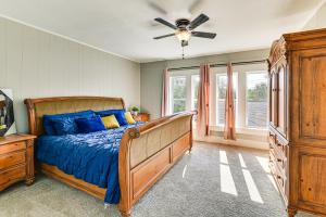 a bedroom with a bed and a ceiling fan at Near Campus and Casino Family-Friendly Durant Home! in Durant