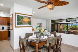 a dining room and kitchen with a table and chairs at KBM Resorts FREE CAR Kaanapali Royal 2-Bedroom Condo an Island Inspired Gem KRO-G201 in Kaanapali