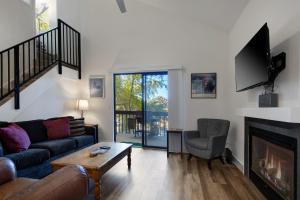 a living room with a couch and a fireplace at Red Pine By Park City Vacations in Park City